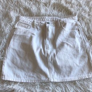 White Skirt, says HAPPY on back pocket